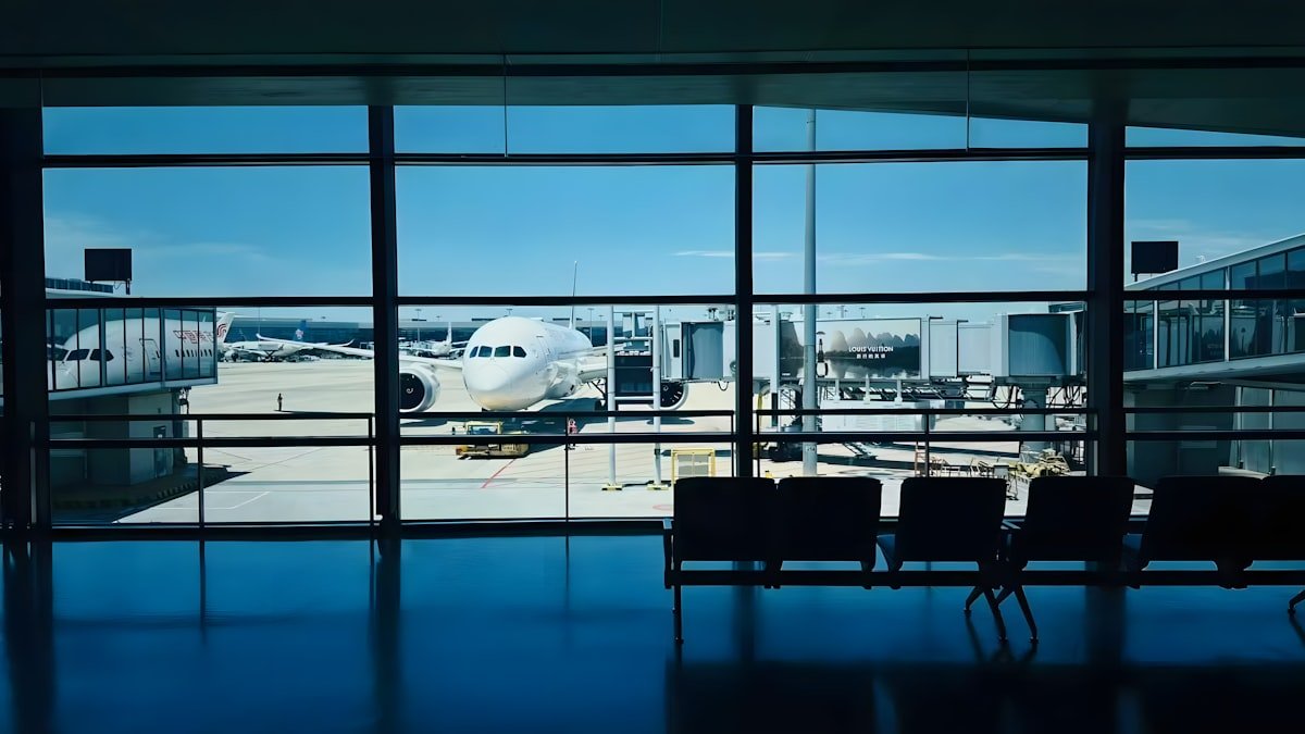 Airplane outside the windows of an airport terminal